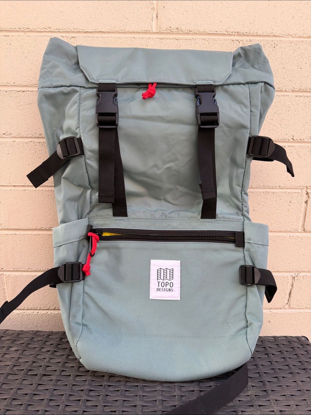 Topo Designs Roll-Top Backpack in Sage with Red Pulls